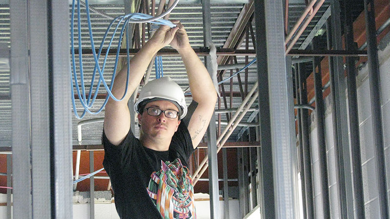 Thomas kraser installing wiring in the Dawson Building