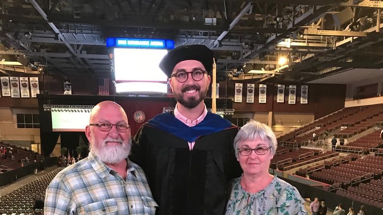 Kovaleski with parents after getting Ph.D.