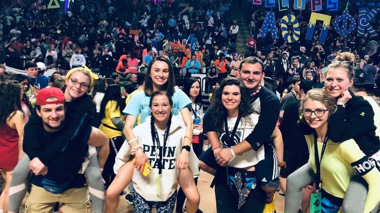 THON dancers get a piggyback ride from the dance floor at end of THON
