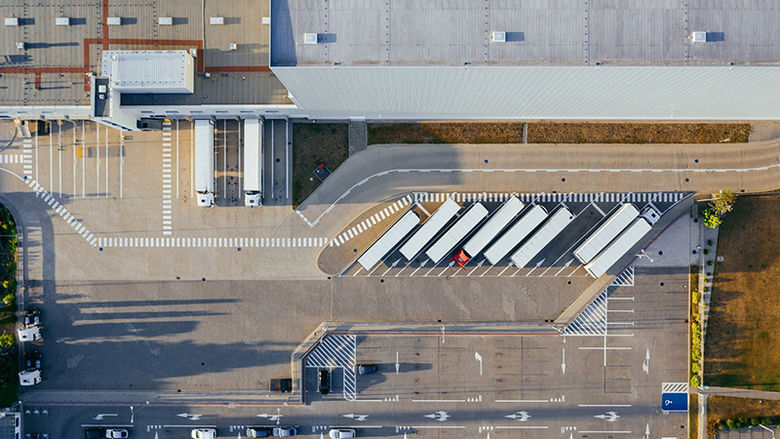 overhead view of trucks lined up at a loading dock