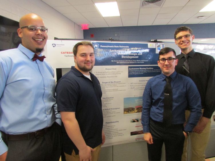 Students showing project at research fair