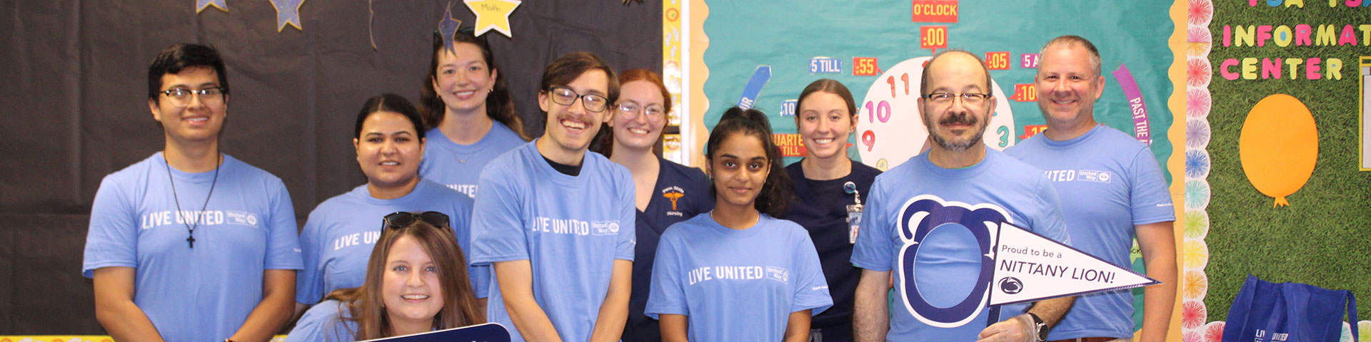 10 volunteers wearing united way day of caring tee shirts